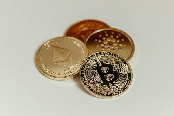 Ethereum, Bitcoin and other cryptocurrency coins arranged together on a white background